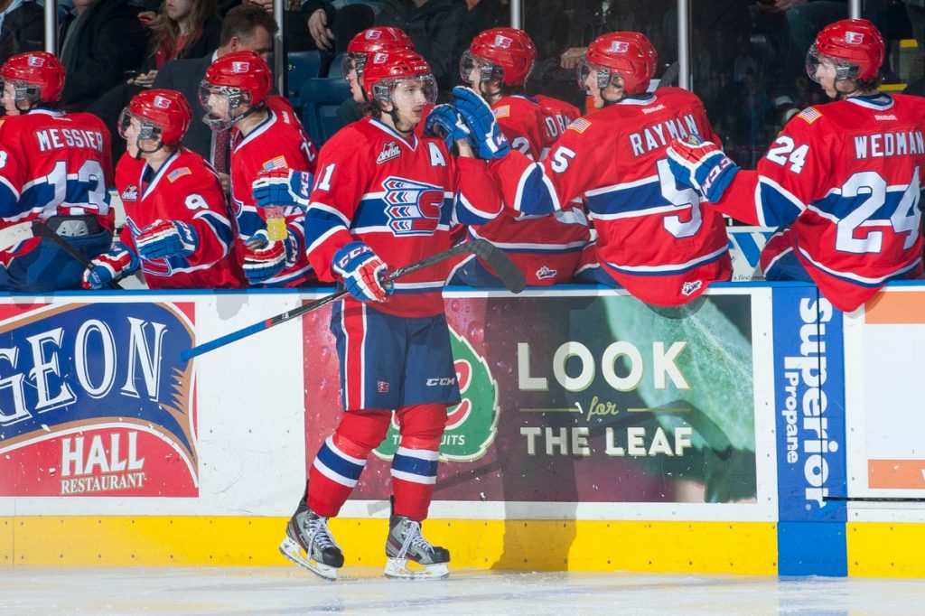 Liam Stewart in hockey uniform on the ice