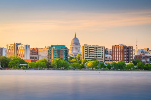The skyline of Madison, Wisconsin from the lake at dusk