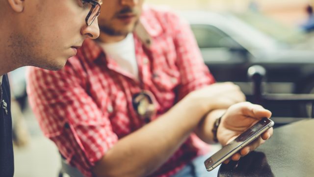 Two men share photos, video on a Samsung phone