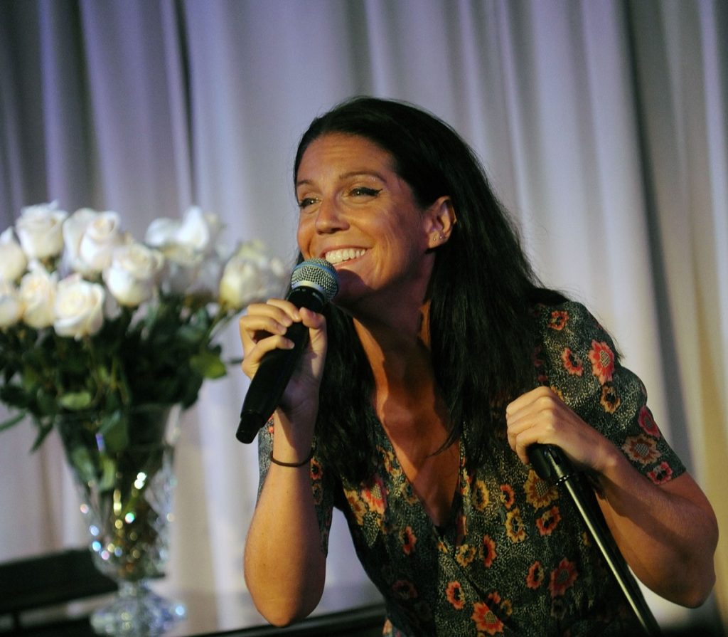 AJ Lambert singing into microphone