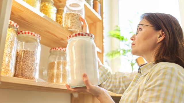 Lady inspecting pantry items