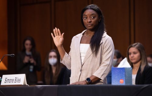 Simone Biles being sworn in to testify during a Senate Judiciary hearing regarding the FBI's investigation of Larry Nassar on September 15, 2021