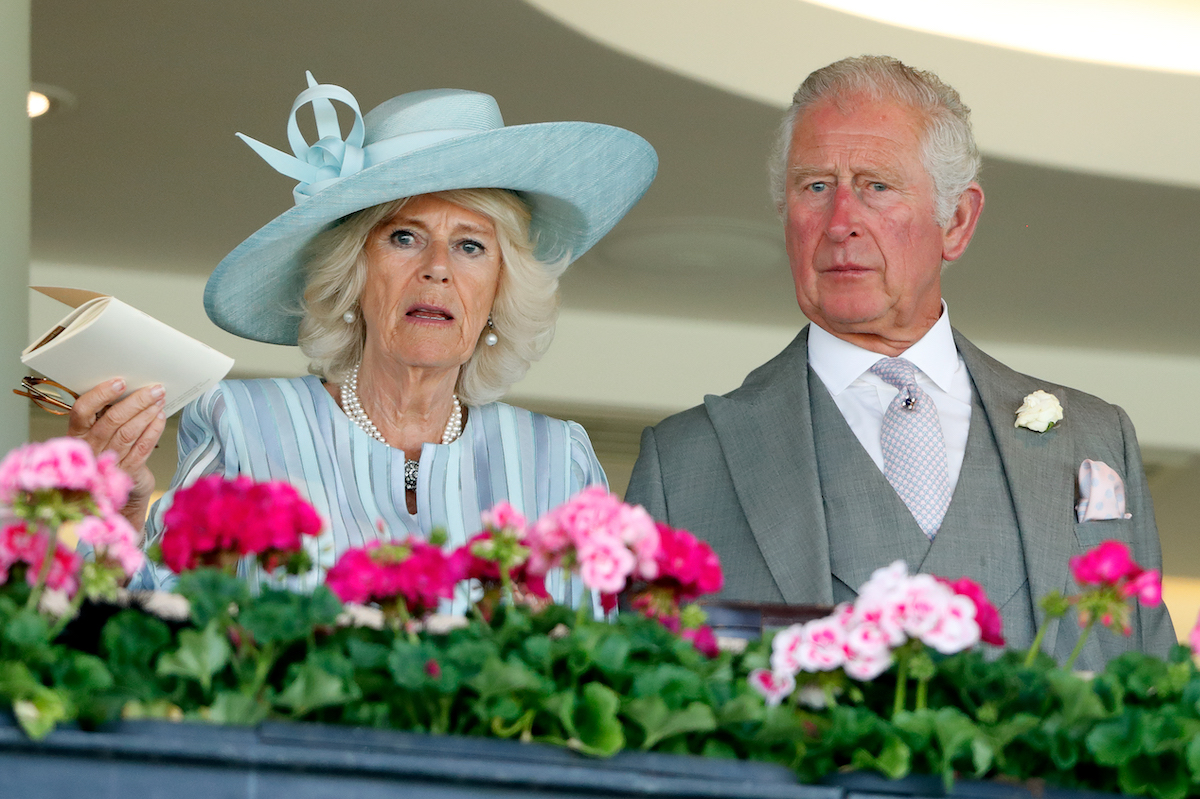 Camilla, Duchess of Cornwall and Prince Charles, Prince of Wales watch the racing as they attend day 1 of Royal Ascot at Ascot Racecourse on June 15, 2021 in Ascot, England.