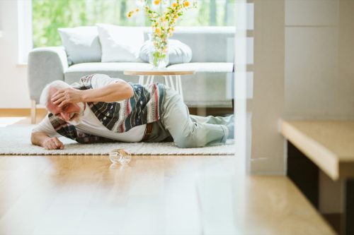 Elder man falling on the floor, photo