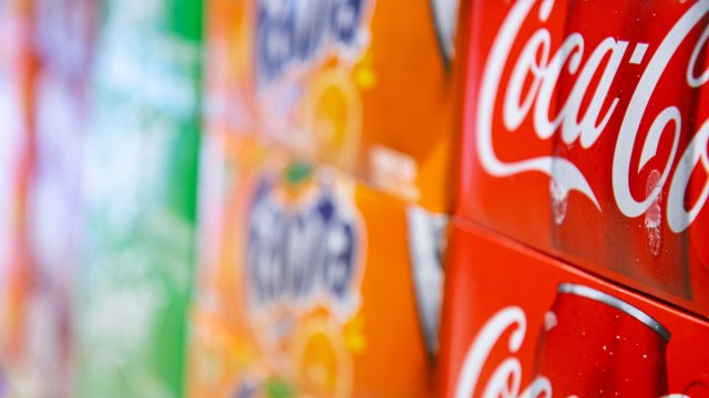 A local local grocery store has just restocked their Coke Products.