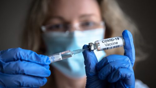 holding covid-19 vaccine