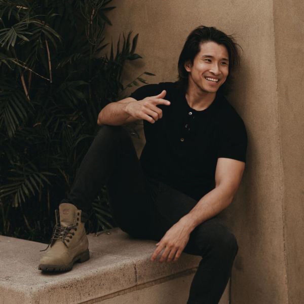 A man wearing a henley t-shirt