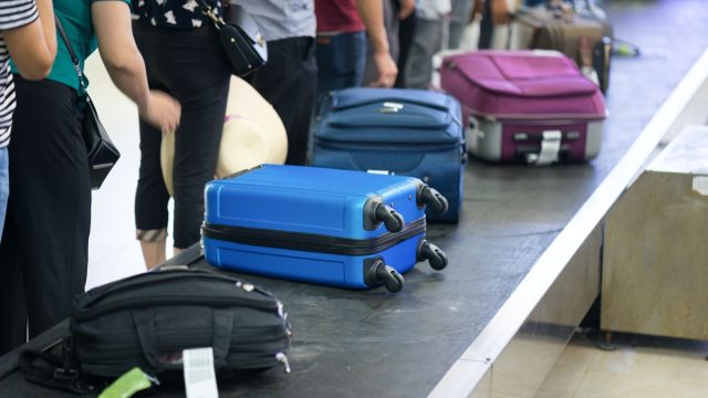 Passengers waiting at baggage claim