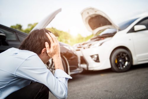 Driver in front of car car