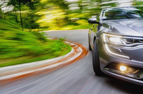 Car speeding in a curse