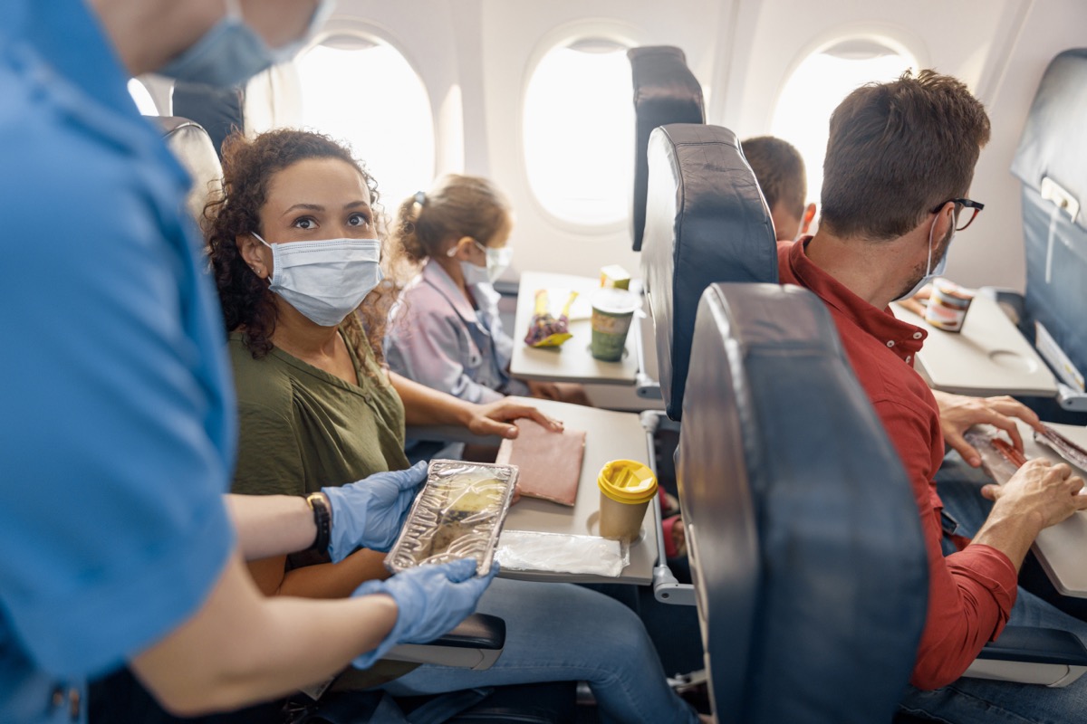 Passengers getting food on a plane
