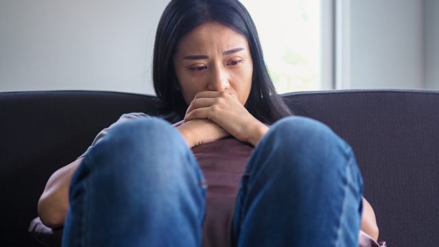 Woman frustrated on the couch