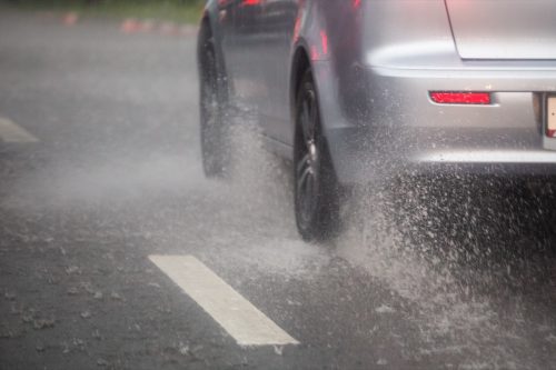 Wheels moving fast in the rain