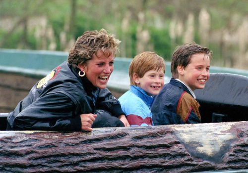 Princess Diana, Prince Harry, and Prince William on a log ride at the Thorpe Park amusement park in 1993