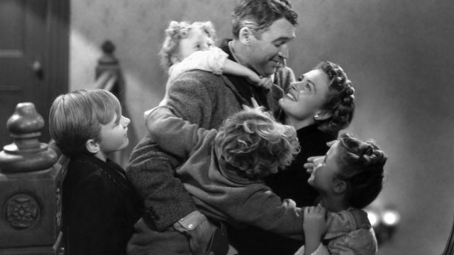 James Stewart, Donna Reed, Carol Coombs, Jimmy Hawkins, Larry Simms, and Karolyn Grimes in "It's a Wonderful Life"
