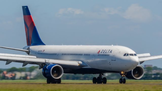 Delta Airlines Airbus A330 landing at Schiphol airport near Amsterdam in The Netherlands.