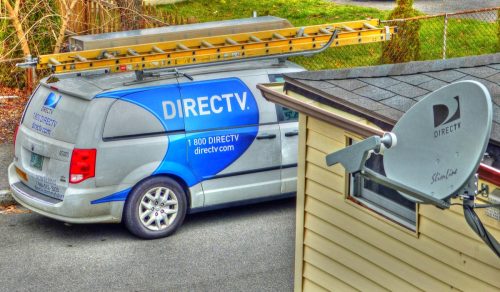 HDR image, DirecTv installation satellite dish antenna, company service truck - Revere, Massachusetts USA - September 29, 2015