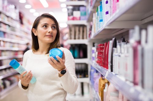 A woman shopping for hair products in the store