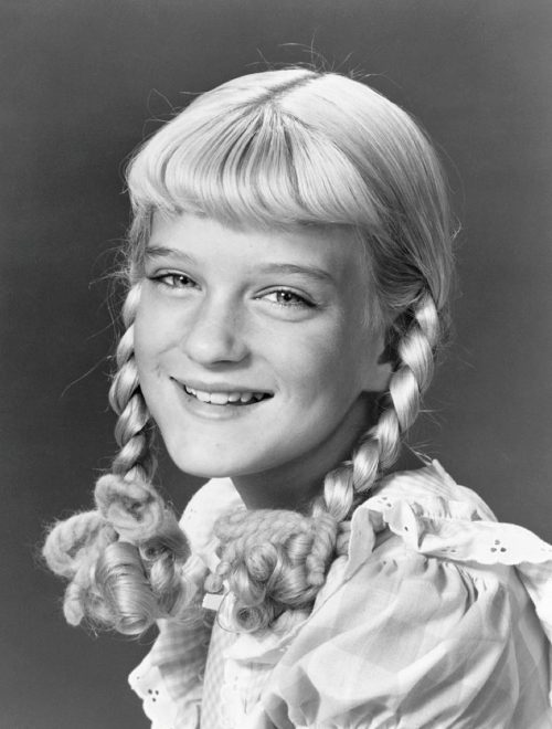 headshot of susan olsen on the brady bunch