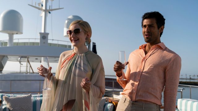 Julia Garner and Saamer Usmani in Inventing Anna