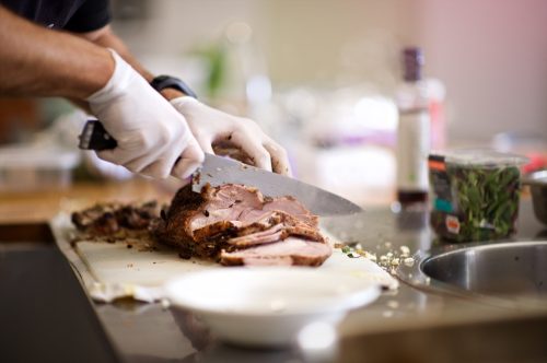 meat being cut after being cooked