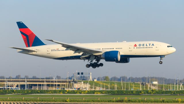 A Delta plane landing at an airport