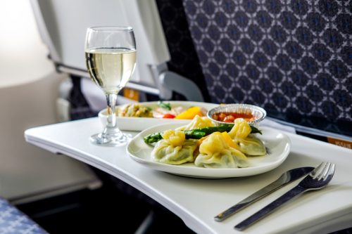Tasty meal served on board of airplane on the table
