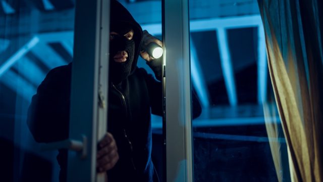 robber breaking into house