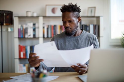 Mid adult man working at home