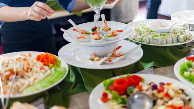 Many plates of food on a cruise