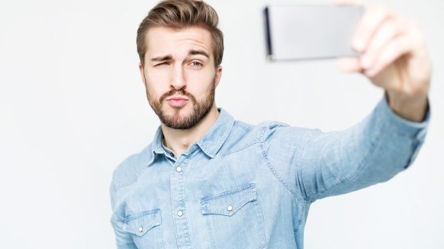 man taking selfie