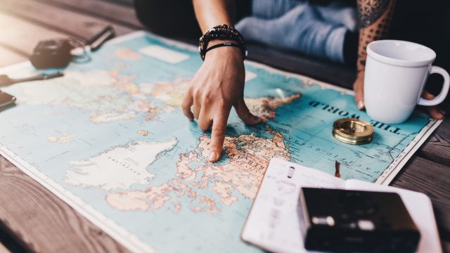 someone pointing on a map