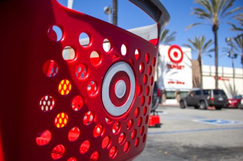 A shopping cart is parked in front of the Target department store