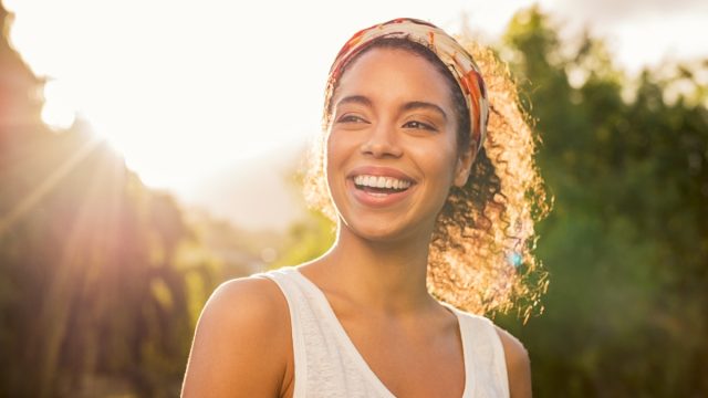 woman smiling at sunset