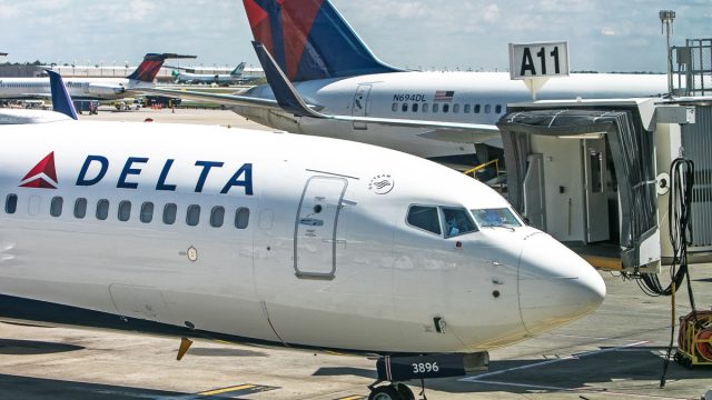Delta Airlines passenger jet arrives at a gate at Hartsfield-Jackson Atlanta International Airport.