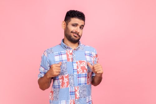 man pointing at himself