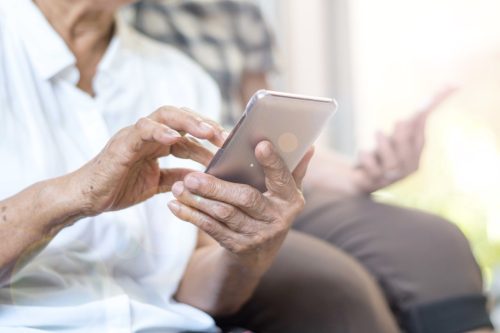 older person using cell phone