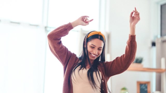 woman dancing in sunshine