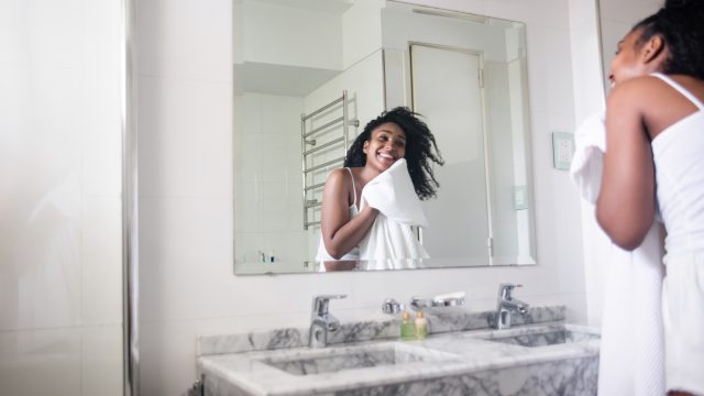 woman washing her face