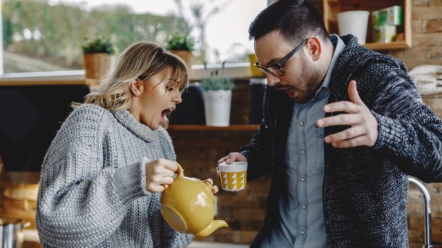 clumsy woman spilling drink