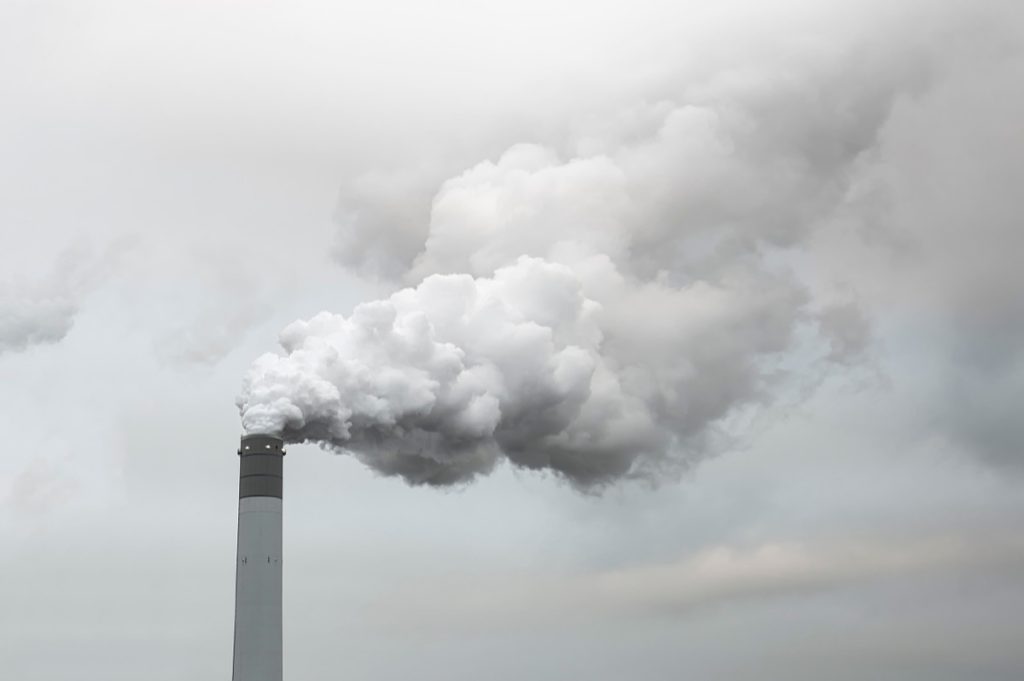 Smoke coming from factory pipe