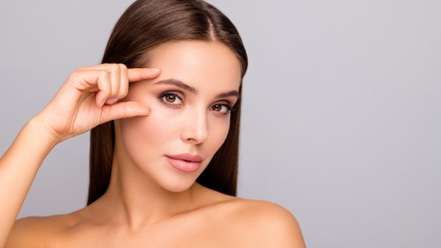 woman showing off eyebrows