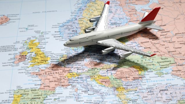 Model Airplane on Map of Europe