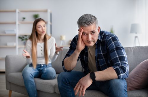 couple arguing, man ignoring woman