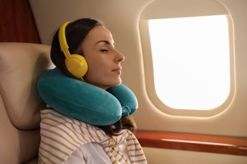 Woman Sleeping on a Plane