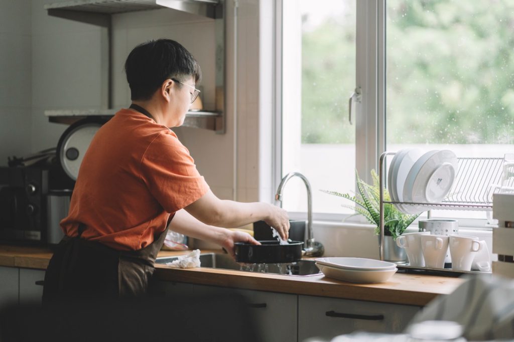 washing dishes at kitchen