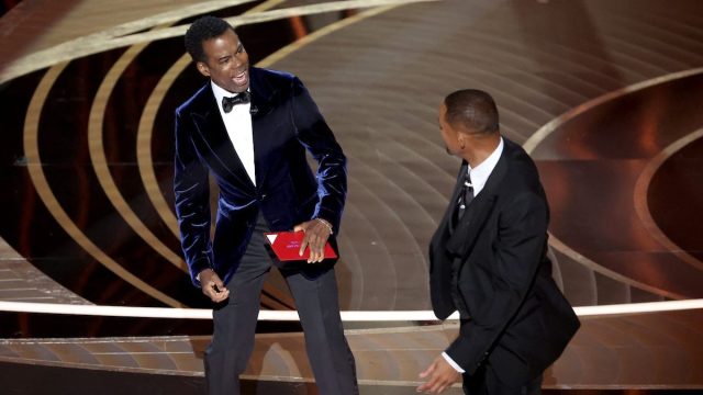 Chris Rock and Will Smith on stage at the 2022 Oscars