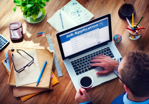 man filling out job application