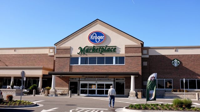 On a beautiful morning a customer walks into the Kroger Superstore to do some shopping.