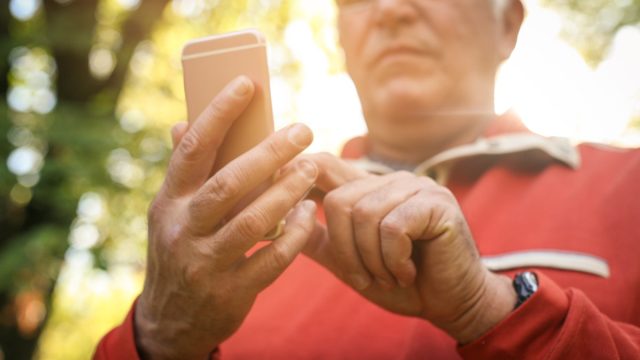 man outside on phone